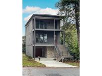 Modern two-story home with gray siding, and a detached garage at 1103 Church Nw St, Atlanta, GA 30318