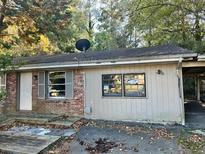Ranch-style home with brick facade and carport at 343 Patricia Sw Ave, Marietta, GA 30060