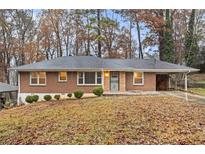Brick ranch house with a landscaped yard at 2052 Brannen Se Rd, Atlanta, GA 30316