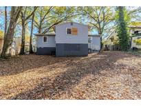 Cozy backyard with mature trees and a spacious area at 231 Glenrose Sw Cir, Atlanta, GA 30354