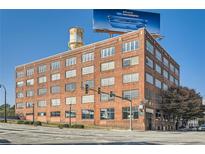 Brick building with many windows and a billboard in the background at 426 Marietta Nw St # 410, Atlanta, GA 30313