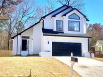 Stunning two-story home with modern exterior and landscaping at 1445 Watercrest Cir, Lawrenceville, GA 30043