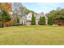 Brick home with large front yard and mature trees at 4230 Cole Rd, Villa Rica, GA 30180