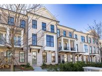 Brick townhouses with front porches and landscaping at 280 Briscoe Way # 38, Alpharetta, GA 30009