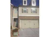 Two story townhome with double garage and neutral colors at 5671 Radford Loop, Fairburn, GA 30213