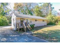Ranch style house with a small front porch and driveway at 1777 W Austin Rd, Decatur, GA 30032