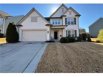 Two-story house with white siding, gray shutters, and a landscaped yard at 325 Ridgewood Trl, Canton, GA 30115