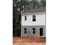 Two-story house with gray and white siding, featuring multiple windows at 7260 Crestside Dr, Austell, GA 30168