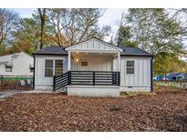 Charming white cottage with black accents and a front porch at 4103 Brenda Dr, Decatur, GA 30035