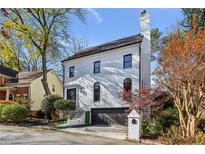 Stunning two-story home with brick facade and attached garage at 1445 Sheridan Ne Walk, Atlanta, GA 30324