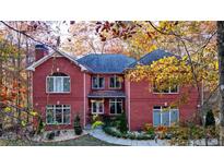 Brick house with large windows, a two-car garage and a walkway at 271 Brooks Rackley Rd, Dallas, GA 30157