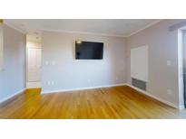 Bright living room with hardwood floors and access to balcony at 300 Johnson Ferry Ne Rd # B611, Atlanta, GA 30328