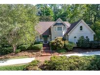 Two-story house with brick walkway, and landscaping at 1276 Oleander Sw Dr, Lilburn, GA 30047