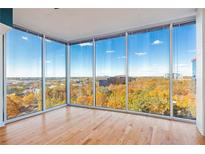 Bright living room with hardwood floors and stunning city views at 3300 Windy Ridge Se Pkwy # 1113, Atlanta, GA 30339
