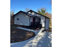 Newly constructed home with modern exterior and driveway at 951 Reed Avenue, East Point, GA 30344