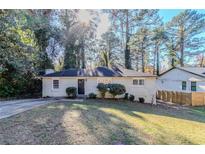 Charming ranch home with a well-maintained lawn and mature trees at 2543 Brentwood Rd, Decatur, GA 30032