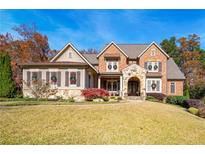 Brick front home with stone accents and a manicured lawn at 3182 Shumard Way, Marietta, GA 30064