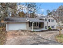 Ranch style home with attached garage and covered porch at 3986 Holland Dr, Douglasville, GA 30135