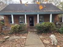 Brick home with covered porch and landscaped yard at 43 Gammon Se Ave, Atlanta, GA 30315
