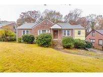 Brick ranch house with a large front yard at 1273 Anchor Sw Ter, Atlanta, GA 30311