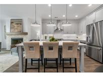 Modern kitchen with island, stainless steel appliances, and pendant lighting at 2521 High Brow St # 42, Duluth, GA 30096