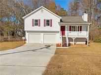 Two-story house with attached two-car garage and deck at 356 Wesley Mill Pl, Villa Rica, GA 30180