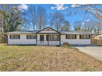 Newly renovated ranch home with modern exterior and landscaping at 111 Charles Pl, Cumming, GA 30040