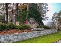 Stone entrance sign of Martins Landing community with festive holiday decor at 1845 Branch Valley Dr, Roswell, GA 30076