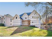 Under construction home with covered porch and grassy yard at 3740 High Green Dr, Marietta, GA 30068