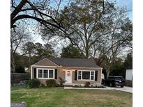 Cute ranch home features a gray exterior, landscaping, and a spacious yard at 5118 Hartsook Ne Dr, Covington, GA 30014