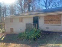 Ranch house with new paint, updated landscaping, and a deck at 2785 Battle Forrest Dr, Decatur, GA 30034