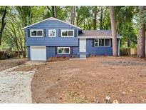 Newly renovated blue house with a spacious yard at 1730 Salina Dr, Jonesboro, GA 30236