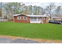 Newly renovated home with a spacious lawn and modern exterior at 40 Moores Pl, Dallas, GA 30157