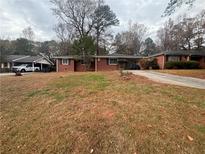 Brick ranch home with a spacious yard at 2893 Heather Dr, Atlanta, GA 30344