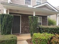 Inviting front exterior featuring stone accents and landscaping at 3050 Centerglen Ln, Cumming, GA 30040