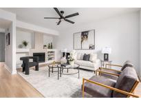 Bright living room with hardwood floors, stylish furniture, and a cozy fireplace at 1210 Cleburne Ne Ave, Atlanta, GA 30307