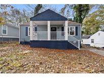 Newly renovated home with blue siding, white trim, and a covered porch at 1417 Graymont Sw Dr, Atlanta, GA 30310