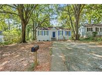 Ranch style home with blue shutters and a spacious yard at 1324 Almont Sw Dr, Atlanta, GA 30310