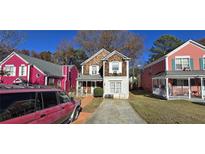 Two-story house with wood siding and a small front yard at 1041 Heritage Valley Rd, Norcross, GA 30093