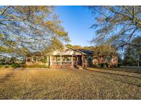 Brick ranch house with a porch and large yard at 1526 N Cherokee N Rd, Social Circle, GA 30025