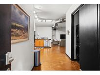 Bright entryway with polished concrete floors, leading to kitchen and living areas at 5300 Peachtree Rd # 108, Atlanta, GA 30341