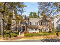 Brick home with white columns and landscaping at 3145 E Addison Dr, Alpharetta, GA 30022