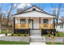 Charming craftsman home features a front porch, freshly landscaped lawn, and modern exterior finishes at 1097 Hubbard Sw St, Atlanta, GA 30310