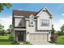 Two-story house with beige siding, a double-door entry, and a two-car garage at 687 Summitt Hill Way, Cumming, GA 30040