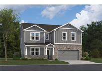 Two-story home with gray siding, stone accents, and a two-car garage at 106 Henley St, Canton, GA 30114