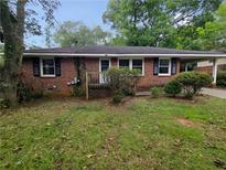 Brick ranch home with a spacious yard and mature trees at 2385 Perkerson Sw Rd, Atlanta, GA 30315