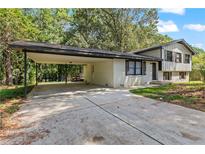 Charming two-story home with a carport and driveway at 67 Heron Dr, Riverdale, GA 30274