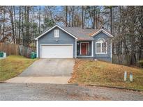 Charming two-story home with a one-car garage and landscaped yard at 2291 Wilkins Ct, Decatur, GA 30035