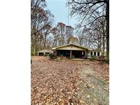 Ranch house with screened porch, attached garage, and large yard at 359 Cornish Mtn Rd, Oxford, GA 30054