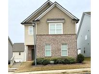 Charming two-story home with brick and siding exterior at 1323 Rosemary Ln, Atlanta, GA 30344